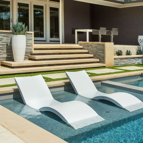 Relaxing on these in pool chaises is the perfect way to spend the afternoon Ledge Lounger, Pool Chaise, Living Pool, Tanning Ledges, Water Feature Wall, Leisure Pools, Pool Lounge Chairs, Pool Chairs, House Backyard