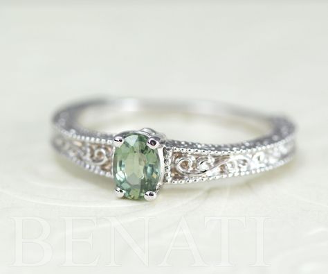 Exclusive to Benati. Green sapphire engagement ring with a antique vintage feel. Crafted to perfection in solid 14k white gold. A unique brilliant engagement ring with beautiful engraving and mill-grain details, this special engagement ring will make her blush. A brand new design inspired by the antique style I love so much. The center oval cut natural green sapphire gem is 6*4 approx. 0.50 carat. Made in the highest craftsmanship - crafted to perfection to a high polish. A unique and original e