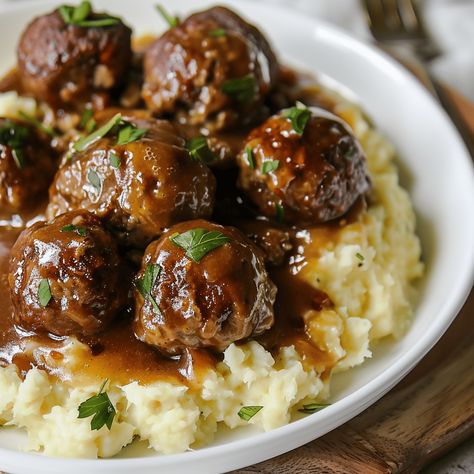 Savor the comfort of "Comfort Classic: Slow Cooker Salisbury Steak Meatballs," a hearty and delicious dish that transforms the traditional Salisbury steak into succulent, easy-to-serve meatballs. Cooked slowly in a rich mushroom gravy, these meatballs Salisbury Steak Crockpot, Meatball Recipes Crockpot, Salisbury Steak Meatballs, Slow Cooker Salisbury Steak, Crockpot Steak, Rasta Pasta, Meatballs And Gravy, Baked Ribs, Crock Pot Meatballs