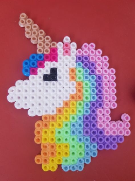 Unicorn, pastel, perler, hamma, beads Hama Beads Unicorn Pattern, Unicorn Hama Beads, Unicorn Perler Beads, Pastel Perler Bead Patterns, Perler Unicorn, Ikea Pyssla Ideas, Perler Beads Unicorn, Unicorn Perler Bead Pattern, Plastic Bead Crafts