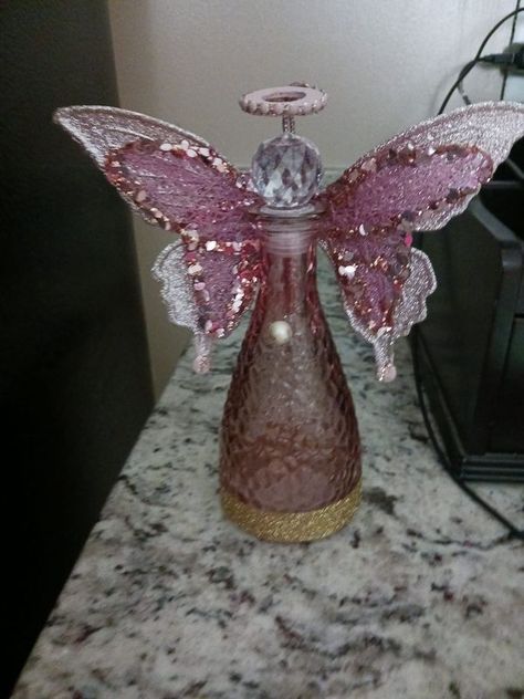 Dollar Tree Fanatics Crafts & Decor | This is my Dollar Tree bottle Angel and if you're having trouble finding the wings these are butterfly ornaments in the Christmas department at Walmar... | Facebook Dollar Tree Angel Wings Ornament, Diy Dollar Store Crafts Christmas, Dollar Tree Angel Wings, Angel Vases, Altered Bottles Diy, Christmas Angel Ornaments Handmade, Angels Crafts, Angel Wing Crafts, Angels Diy