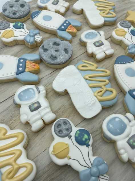 Textured Parchment from Sweet Sheets make these cookies extra dimensional.  All gluten free and pastel themed as requested. Rocket Cookies Royal Icing, First Trip Around The Sun Cookies Decorated, Astronaut Cookies Decorated, Astronaut Birthday Cookies, Astronaut Royal Icing Cookies, Royal Icing Decorated Cookies, Rocket Space, Space Birthday, Lost In Space