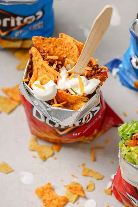 Handheld and tasty, this Doritos Walking Taco recipe is your new favorite portable snack! This is an easy way to turn a bag of chips into a mini taco bowl that you can take on the go. Walking Snacks, Mexican Snack Foods, Walking Tacos Recipe, Doritos Taco, Mini Taco, Walking Taco, Taco Bowl, Walking Tacos, Sacred Woman