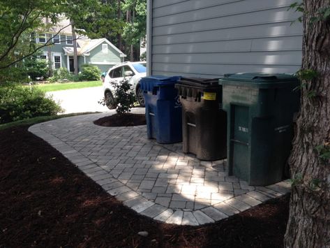 Front Yard Landscaping Sitting Area, Trash Can Landscaping, Simple Outdoor Landscaping Ideas Front Yard, Paver Area For Trash Cans, Landscaping Around Back Deck, Garbage Can Paver Pad, Simple Landscaping Front Of House, Hiding Trash Cans Outside, Front Yard Concrete Ideas