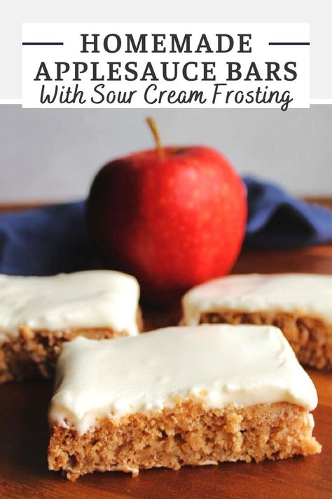 3 pieces of thin applesauce sheet cake topped with white sour cream icing sitting in front of a red apple. Applesauce Recipes Baking, Applesauce Bars, Recipe Using Applesauce, Sour Cream Icing, Sour Cream Muffins, Applesauce Cookies, Sour Cream Frosting, Homemade Apple Butter, Apple Notes