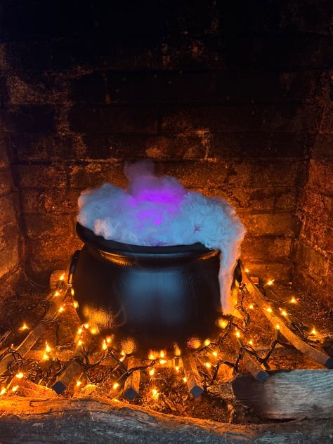 Black plastic cauldron sitting atop orange lights, stuffed with fake spiderwebs and a diffuser. Diy Halloween Cauldron, Cauldron Decor, Orange String Lights, Halloween Cauldron, Witchy House, Witches House, Driveway Ideas, Halloween 11, 2024 Halloween