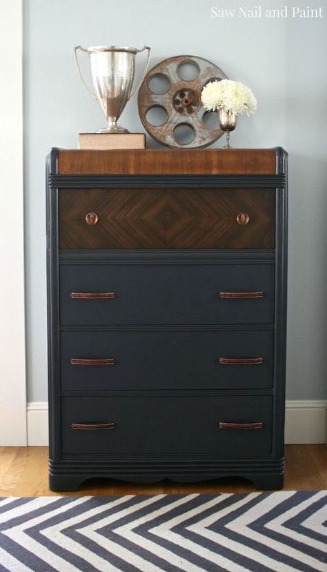 This vintage waterfall dresser was listed for free on Craigslist. It had been abandoned by a previous homeowner, and as you can see, needed some love. That's where I stepped in. I removed all the hardware and gave it a good cleaning. The veneer was in bad shape, but I saved what I could and removed the rest. I sanded the entire piece, stained the top and the drawer with the awesome chevron veneer, and painted the rest a custom charcoal gray. I sealed the entire piece with a top… Waterfall Furniture, Waterfall Dresser, Diy Furniture Restoration, Furniture Rehab, Dresser Makeover, Furniture Renovation, Deco Furniture, Dresser Decor, Art Deco Furniture