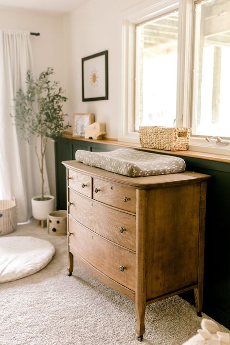 Boho Chalet Decor, Unthemed Nursery, Old Time Nursery, Vintage Dresser As Changing Table, Non Traditional Nursery Ideas, Mixed Wood Nursery Furniture, Light Wood Furniture Nursery, Earthy Antique Home, Nursery With Wood Furniture