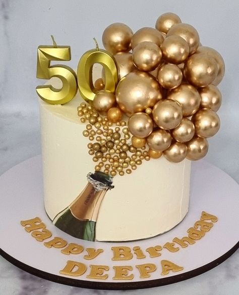 Champagne bottle cake decorated with Golden faux balls 50th Cake Designs Birthday, Champagne Bottle Cake Ideas, Champagne Cake Ideas, Mens 70th Birthday Cake, Birthday Cake With Champagne Bottle, Champagne Themed Cake, Champagne Theme Cake, Champagne Color Cake, Cakes For 50th Birthday For Women