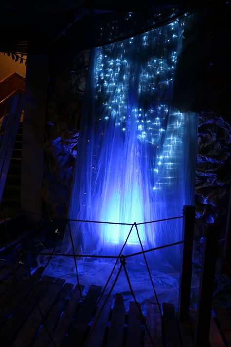 Waterfall made by layering shiny blue taffeta with white tulle and christmas lights Waterfall Set Design, Waterfall Stage Design, Sea Stage Design, Ice Kachang, Forest Theatre Set Stage Design, Ocean Set Design Theatre, Lapland Christmas, Tulle Lights, Tulle Backdrop