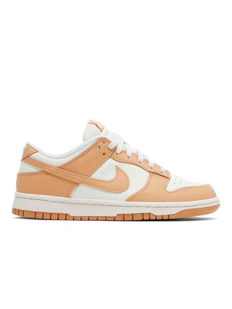 Nike Dunk Low Harvest Moon (W) The Nike women’s Dunk Low ‘Harvest Moon’ dresses the retro hoops shoe in a refined two-tone color scheme, highlighted by a leather upper that combines a clean white base with contrasting overlays in a subtle peach beige hue. The sneaker is appointed with standard Dunk features, including a perforated toe box, breathable nylon tongue, and embroidered Nike branding on the back tab. Anchoring the low-profile silhouette is a sturdy rubber cupsole, featuring white sidew Nike Dunk Low Harvest Moon, Wmns Dunk Low, Moon Dresses, The Harvest, Harvest Moon, Trendy Sneakers, A Bathing Ape, Nike Dunk Low, Dunk Low