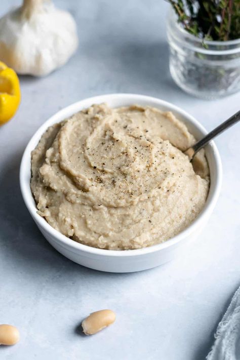 Looking for an easy and tasty alternative to mashed potatoes? Try this white bean mash recipe! Made with white beans, garlic, onion and thyme, this mash is a flavorful and creamy side dish. It's also a great source of protein and fiber, making it a nutritious addition to any meal. Serve it alongside grilled chicken or fish, or use it as a dip for veggies or crackers. Gluten-free & dairy-free. Get ready to enjoy a delicious twist on a classic side dish! White Bean Mash, Mock Mashed Potatoes Cauliflower, Mashed Beans, Mayocoba Beans, Bean Mash, Dip For Veggies, Sprouts Recipes, Mash Recipe, Roasted Chicken Breast