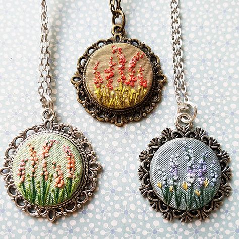 A garden of embroidered pendants. #embroidery #gardenembro… | Flickr Hand Embroidered Jewelry, Garden Embroidery, Miniature Embroidery, Embroidered Necklace, Pola Sulam, Brazilian Embroidery, Embroidery Flowers Pattern, 자수 디자인, Sewing Embroidery Designs