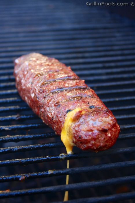 Hamburgers rolled into large hot dog shapes, stuffed with a cheese stick and cooked on the grill | Cheese Stick Burger Dogs | https://grillinfools.com Grilled Cheese Sticks, Hamburger Rolls, Grill Cheese, Burger Mix, Beef Ribs Recipe, Cheese Stick, Grilled Oysters, 200 Dollars, Burger Dogs