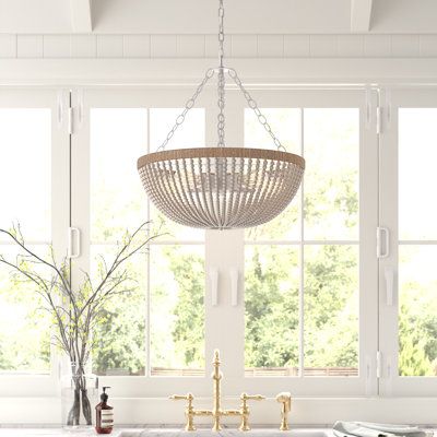 This Kaylin 5 - Light Unique / Statement Empire Chandelier brings a glam feel and ambient light to your space. It features a metal canopy and chain download suspending a single horizontal circle made of oak and hemp rope. From the circle hang strands of wood beads, swooping down and around the interior blubs to form a semi-circle design. The farmhouse takes on the classic empire fixture and creates an elevated rustic feel, ideal for your entryway, bedroom, or living room. This fixture is height- Bathtub Lighting Fixture, Coastal Chandelier Dining Room, Wicker Light Fixture, Bathtub Lighting, Chandelier Wood, Basement Kitchenette, Coastal Chandelier, Boho Chandelier, Wood Bead Chandelier