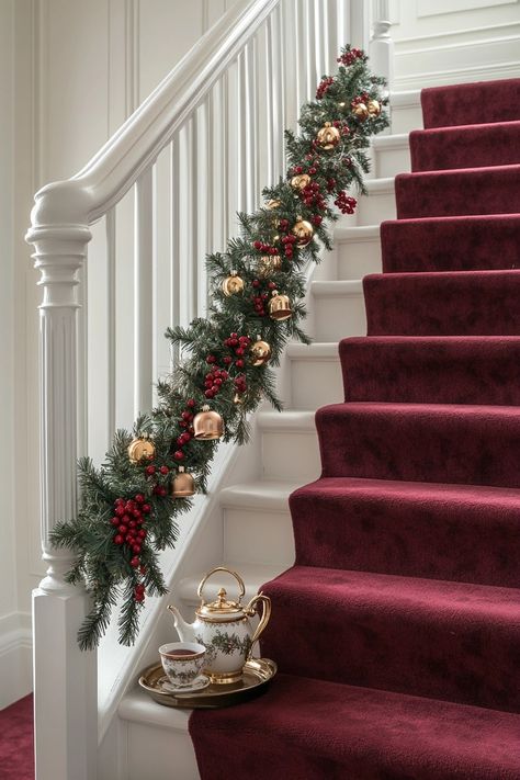 Transform your staircase with stunning garlands and golden ornaments for a cozy Christmas home decor vibe. Elevate your festive spirit and welcome guests with warmth and style. Perfect for any holiday gathering! #ChristmasDecor #HomeStyle #FestiveVibes Stairway Christmas Decor Staircases, Holiday Staircase Decor, Christmas Railing Decor Indoor, Stairs Christmas Decorations, Stairway Decorating Christmas, Stairway Garland, Garland Staircase, Christmas Garland Staircase, Cozy Christmas Home