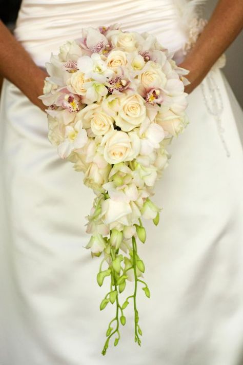 Bride's Elegant Teardrop/Cascade Bouquet: White/Pink Cymbidium Orchids, White Orchids + Buds, Cream Roses Bouquets Peonies, Popular Wedding Flowers, Flowers Guide, Trailing Bouquet, Orchid Bridal Bouquets, Wedding Planning Boards, Unique Wedding Bouquet, Red Bouquet Wedding, Traditional Roses