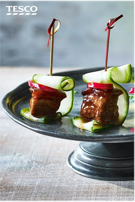 Impress your guests at your next drinks party with this easy pork belly canapé recipe. Inspired by Asian flavours, sticky hoisin pork belly squares are skewered with spicy chilli and refreshing cucumber. | Tesco #pork #canapes Easy Canapes Make Ahead, Cold Canapes Ideas, Pork Belly Skewers, Easy Pork Belly, Canapé Ideas, Sticky Pork Belly, Canapes Ideas, Week Meals, Dish Design