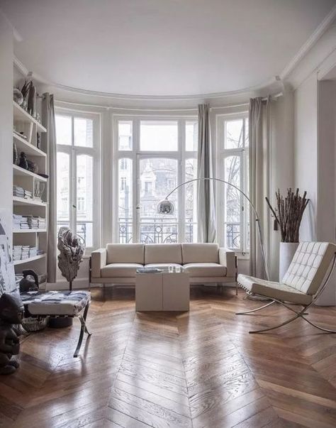 A contemporary Parisian living room with all whites and a hardwood parquet floor to soften the space Parisienne Apartment, Parisian Living Room, Glam Barbie, Modern Appartement, Modern Apartment Design, Interior Desig, Contemporary Apartment, Best Interior Design, A Living Room