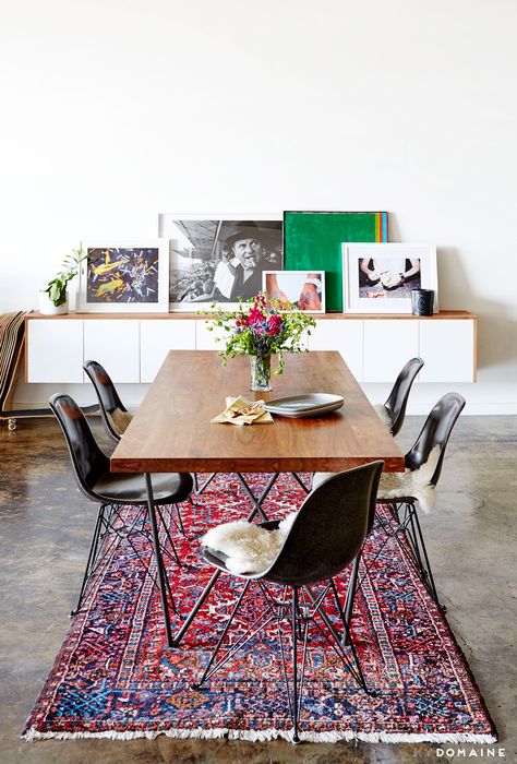 An industrial and modern dining space with leaning artwork, Persian rug, and wood dining table Interior Vintage, Cosy Living, Basement Makeover, Beautiful Dining Rooms, Loft Living, Chaise Design, Dining Room Inspiration, Natural Home Decor, On The Floor