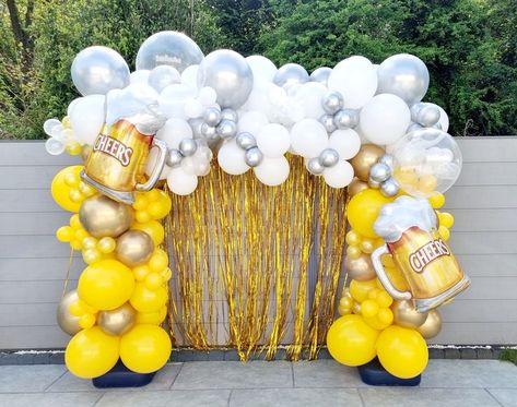 Yellow and white organic balloon arch with beer foil balloons Cheers To Beers Party, Beer Party Theme Decorations, Beer Fest Birthday Party, Beer Mug Balloon Arch, Beer Festival Decorations, Beer Backdrop Ideas, Bubbles And Brews Balloon Arch, Beer Theme Balloon Garland, Cheers And Beers Balloons Garland