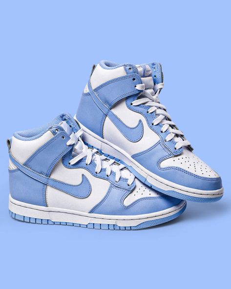 Dressed in a White and Aluminum color scheme. This Nike Dunk High features a White leather base, nylon tongues, and midsole paired with Aluminum Blue – not University Blue – leather and Swoosh overlays. The same light hue continues on the laces, liner, tongue labels, insole, and rubber outsole completes the design. Nike Dunk High Aluminum, Dunk High Aluminum, Dunk High, High Sneakers, Nike Dunk High, Sb Dunk, University Blue, Nike White, Nike Dunk