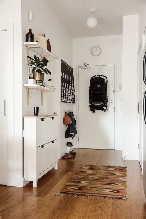 A 600-Square-Foot Vancouver Family Home. Like the shelves and brackets and use of IKEA spice racks. Vstupná Hala, Apartment Entryway, Home Entry, Small Entryways, Decor Ikea, Nyc Apt, Hallway Storage, Small Apartment Decorating, Small Entryway