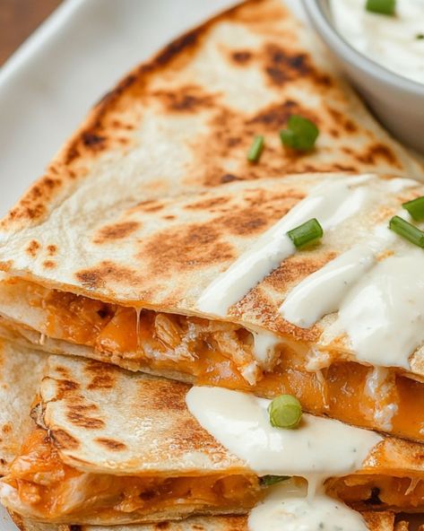 These easy Buffalo Chicken Quesadillas are the perfect combination of spicy buffalo sauce, tender shredded chicken, and melted cheese, all wrapped in a crispy tortilla. Perfect for a quick weeknight dinner or a satisfying game day snack. Ready in minutes, this flavorful recipe is sure to be a family favorite. Serve with ranch dressing for dipping or top with fresh cilantro for added flavor. Learn how to make this simple and delicious dish that’s ideal for lunch, dinner, or any occasion. Buffalo Chicken Dip Quesadilla, Buffalo Chicken Quesadilla Easy, Spicy Chicken Quesadilla, Buffalo Chicken Sauce, Buffalo Chicken Quesadilla, Pizza Pasta Bake, Smothered Pork Chops Recipe, Deep Dish Pizza Recipe, Easy Buffalo Chicken