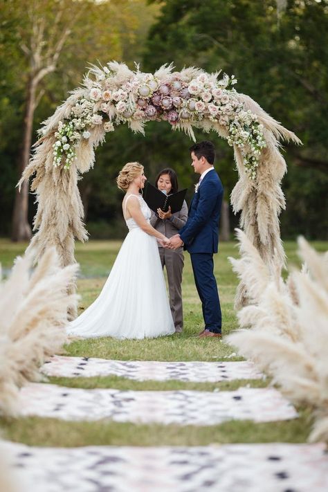 An aisle lined with pampas grass leads to this stunning pampas grass installation ceremony arch altar with  proteas and garden roses! | 13 Whimsical Ways to Use Pampas Grass in Your Wedding | #equalitymindedweddings #lgbtweddingmagazine #loveinc #pampasgr Grass Decoration, Aisle Markers, Wedding Ceremony Ideas, Grass Wedding, Wedding Rituals, Ceremony Arch, Wedding Boho, Aisle Decor, Martha Stewart Weddings