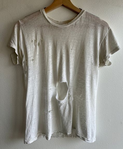 The Vintage communities obsession with Dirty, ripped and degraded shirts… Where people will buy sometimes up to 60 years old, dirty, torn and moth eaten shirts for often way over the price of a brand new tee Let’s have discussion, Would/do you wear these type of shirts? If so, why? Would you pay over the price of a brand new shirt for a shirt most people would consider trash? Orphan Costume, Ripped Shirt, Torn Clothes, Distressed Tshirt, Ripped Shirts, Distressed Shirt, Doll Wigs, The Vintage, Types Of Shirts