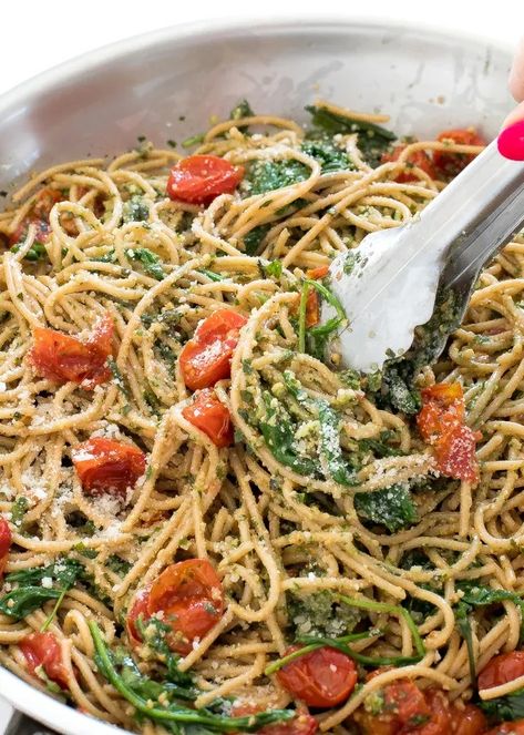 Twist on the traditional pesto with walnuts and fresh basil. Roasted tomatoes, wilted spinach, and arugula are also added to the pasta. Walnut Pesto Pasta, Basil Walnut Pesto, Wilted Spinach, Walnut Pesto, Tomato Basil, Pesto Recipe, Pesto Pasta, Fresh Basil, Roasted Tomatoes