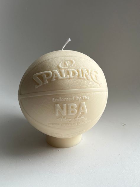 Introducing our new decorative candle shaped in the iconic shape of a basketball. This candle is perfect for any basketball fan or for adding a unique touch to your home decor. The basketball design is detailed and realistic, making it a great conversation piece for any room in your home. Light up your game room, living room, or bedroom with this fun and unique candle. A great gift idea for the basketball lover in your life. Grab yours today and show off your love for the game! approx. 811g Basketball Room Decor, Basketball Room, Ball Candles, Future Apartment Decor, Basketball Design, Cute Bedroom Decor, Future Apartment, A Basketball, Apartment Decor Inspiration