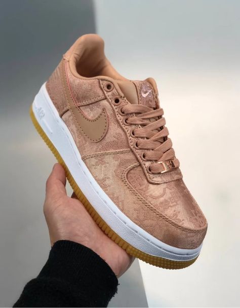 Launching in January 2020, the CLOT x Air Force 1 Low PRM 'Rose Gold' follows on the heels of the previous year’s ‘Royale University’ and ‘Black’ AF1 collaborations. Like its predecessors, this edition features a silk upper embellished with traditional Chinese patterns. The material is designed to wear away, revealing a leather build underneath. The low-top sits on a classic white foam midsole, reinforced by a gum rubber outsole underfoot. Nike Air Force 1 Low-top Casual With Air Cushioning, Nike Air Force 1 Pink Gold, Luxury Low-top Nike Air Force 1 For Streetwear, Basketball Shoes Women's, Luxury Classic Low-top Nike Air Force 1, Black Af1, Luxury Nike Air Force 1 Low-top With Rubber Sole, Nike Air Force 1 Outfit Woman, Air Force 1 Outfit Woman