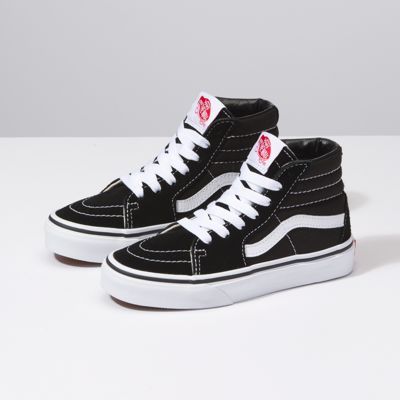 The Sk8-Hi, Vans legendary lace-up high top inspired by the classic Old Skool, has a durable suede and canvas upper, a supportive and padded ankle, and Vans vulcanized signature Waffle Outsole. Black High Top Vans, Nike Kids Shoes, Sk8 Hi Vans, Tenis Vans, Dr Shoes, Vans Kids, Black And White Shoes, High Top Vans, Black High Tops