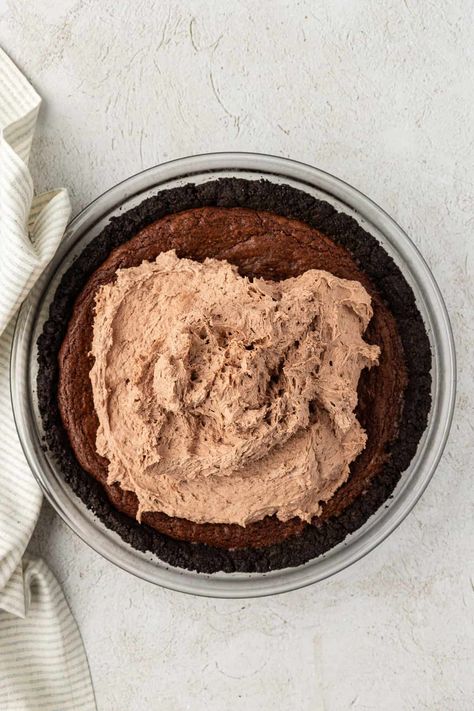 I grew up eating mud pie and have been making this dessert for as long as I can remember. Over the years, I've perfected my recipe using all of my baking experience, into the absolute best version of Mississippi mud pie!'ve perfected my recipe using all of my baking experience, into the absolute best version of Mississippi mud pie! Mud Pie Recipe, Mississippi Mud Pie, Cookie Cookbook, Mississippi Mud, Oreo Crust, Fudge Sauce, Crumb Topping, Cookie Crumbs, Delicious Pies