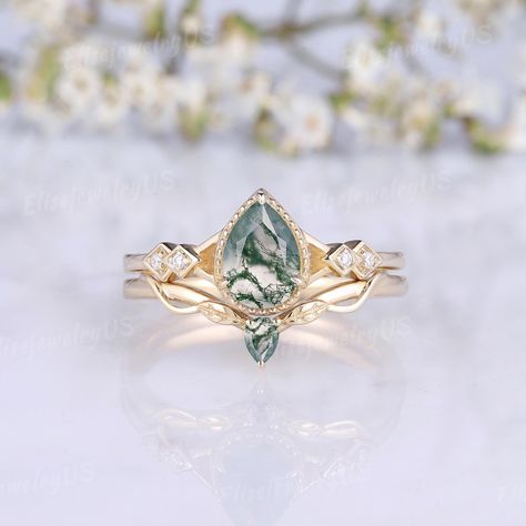 Dainty Moss Agate Engagement Ring Set Pear Agate Rings Moissanite Gold Rings Dainty Leaf Wedding Rings Set Twig Band Promise Rings Set Moss agate is natural, and each agate is different. This makes each piece of moss agate jewelry unique. It is normal that the agate on the finished jewelry won't be the same as our pictures. Every moss agate used is carefully selected by me. But if you want to choose the stone yourself, I provide MOSS AGATE SELECTING SERVICE : https://www.etsy.com/listing/1466114 Leaf Wedding Ring Set, Promise Rings Set, Fairytale Engagement Rings, Rings Moissanite, Agate Rings, Leaf Wedding Rings, 6mm Wedding Band, Wedding Rings Set, Moss Agate Jewelry