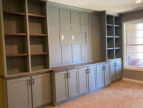 Ikea Living Room Cabinets Built Ins, Built In Shelves Basement Family Room, Theater Room Cabinets Built Ins, Tv Over Built In Cabinet, Entertainment Center Paint Ideas, Sage Built In, Olive Green Built Ins, Shallow Built In Cabinets, Office Cabinet Wall