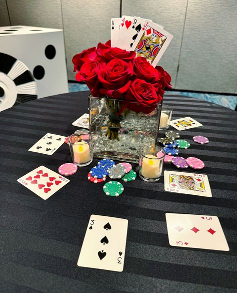 Betting on style! ♠️🌹 Our custom casino-themed centerpiece, complete with playing cards, chips, and roses, brings a touch of elegance to the table.

#casinocenterpiece #casinotheme #casinodecor #casinoevent #vegasnight #vegastheme #vegasdecor #vegasevent #casinonight #playingcards #cards #poker #blackjack #chips #roses #rose #rosecenterpiece #floralcenterpiece #centerpieceinspirations #centerpiece #eventdecor #event #decor #customdecor #custom #florida #orlando Casino Theme Table Centerpiece, Casino Night Table Centerpieces, Casino Themed Centerpieces, Casino Cards, Cards Poker, Vegas Theme, Poker Party, Florida Orlando, Rose Centerpieces