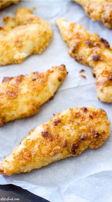 These Oven Baked Ranch Chicken Tenders are baked in the oven instead of fried. These chicken tenders are marinated with ranch dressing, giving this homemade chicken tender recipe incredible flavor! They're a total crowd pleaser.  #recipe #dinner #chicken Chicken Recipes Tenders, Oven Baked Ranch Chicken, Baked Ranch Chicken Tenders, Chicken Tenders Crockpot, Ranch Chicken Tenders, Chicken Tender Recipe, Chicken Tender Recipes Baked, Ranch Dressing Chicken, Ranch Chicken Recipe