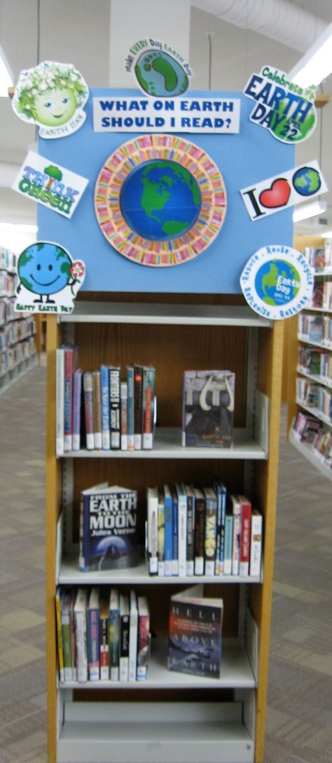 A fun Earth Day library book display titled 'What on Earth should I read next?' Earth Day Library Activities, April Book Displays, Earth Day Library Display, April Library Displays, Earth Day Display, Library Job, School Library Activities, Book Bulletin Board, Holiday Boards