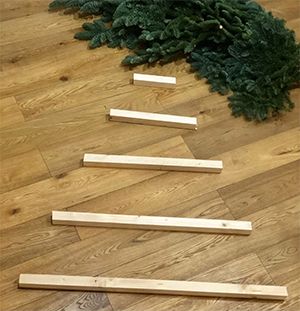 How To Make A Space Saving Christmas Tree - ChristmasTrees.co.uk Wall Mounted Christmas Tree Diy, Diy Hanging Christmas Tree, Dollar Tree Christmas Wall Decor Diy, How To Make A Wall Christmas Tree, Alternate Christmas Tree Ideas, Flat Christmas Tree Wall, Wall Christmas Tree Diy, Christmas Tree On Wall, Space Saving Christmas Tree