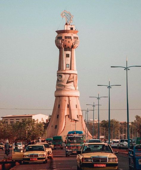 Tour d'Afrique - Tower Of Africa. “If you only visit two continents in your lifetime, visit Africa – twice” R.Elliot.  Bamako is the… Visit Africa, Camera Photo, Digital Camera, Statue Of Liberty, Tower, Statue, Photography, Travel