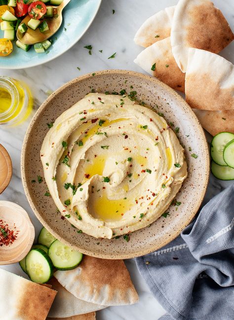 Learn how to make the BEST homemade hummus! My easy hummus recipe calls for just 7 basic ingredients, and it comes out light, fluffy, ultra smooth, and delicious. Serve with warm pita and veggies! | Love and Lemons #hummus #dips #appetizers #healthysnacks Vegan Appies, Eggplant Tahini, Baba Ganush, Best Hummus Recipe, Healthy Dip, Easy Hummus Recipe, Hummus Ingredients, Hummus Recipe Homemade, Beet Hummus