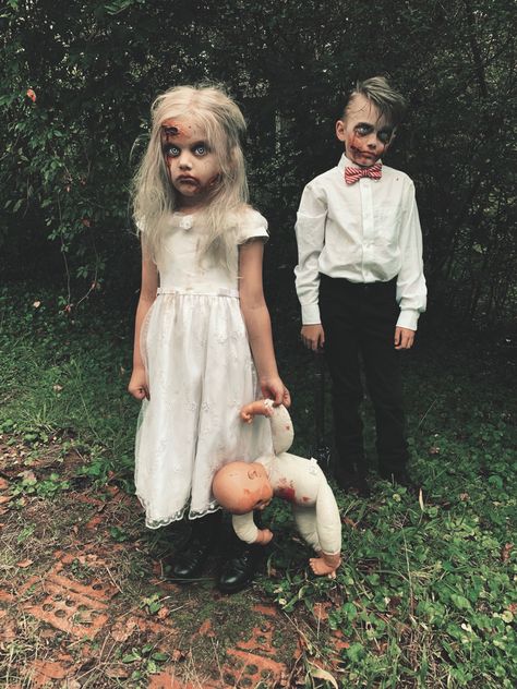 Diy Family Zombie Costumes, Scary Doll Costume Diy, Zombie Family Photoshoot, Scary Doll Costume For Kids, Kids Spooky Photoshoot, Creepy Family Costumes, Creepy Doll Photoshoot, Zombie Kids Costume, Creepy Doll Costume For Kids