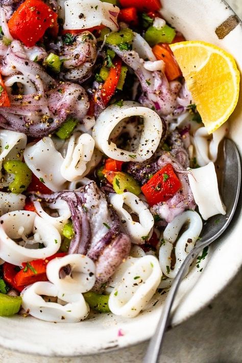 A light refreshing calamari salad made with squid, fresh lemon, celery, red onion, roasted peppers, garlic and parsley. #calamari #squid #seafoodsalad Squid Salad Recipe, Calamari Salad, Squid Salad, Calamari Recipes, Squid Recipes, Salad With Lemon, Seafood Salad, Skinny Taste Recipes, Protein Recipes