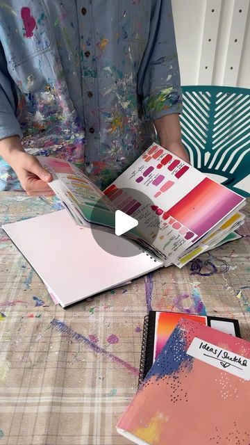 Liz M Clarke on Instagram: "my sketchbooks and me 💞 (a video for those who asked to see a closer look at them 🥰)

I’ve always been one to keep a sketchbook - all throughout school, college and my time at uni, I remember some hating having to do it - but I relished having a place to put all my thoughts and ideas! 

These days I have a couple of different ones kicking about - one for my very very messy and initial sketches, one with straight colour paint swatches and then the one you often see in the background of my videos/photos 😂 which is mainly used to organise and keep track of colour palettes I’m using/wanting to use for pieces - with notes on how I mixed each custom colour in case I need to revisit. 
I always find new inspiration from it every time I flick through too, because I re The Sketchbook, Who Asked, Paint Swatches, Colour Palettes, My Thoughts, School College, Always Be, Custom Color, Paint Colors