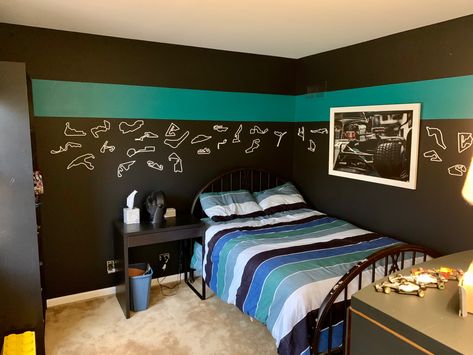 The theme I painted for my son’s bedroom: mercedes colors and formula 1. SW 6941 nifty turquoise. SW 7657 Tinsmith. SW 6992 Inkwell. Bedding is pottery barn teen kelly slater organic tide stripe. And cut-out race tracks and framed poster of lewis hamilton from etsy. F1 Themed Bedroom, Formula 1 Bedroom Ideas, Formula 1 Room Decor, F1 Bedroom Ideas, Formula 1 Bedroom, F1 Bedroom, Racing Bedroom, F1 Room, Bedroom 2022