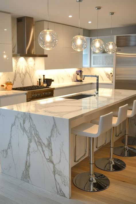 Explore the elegance of the latest kitchen design! This stunning marble island and sleek pendant lighting create a sophisticated and functional space. Perfect for culinary enthusiasts and design lovers. #kitchendesign #marblekitchen #interiordesign Kitchen Island Marble, Modern Marble Kitchen, Island Marble, Latest Kitchen Designs, Marble Island, Marble Kitchen, Modern Marble, Functional Space, Kitchen Marble