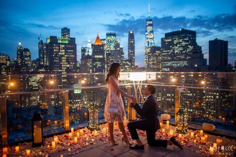 Glowing candles and flower petals on a rooftop in front of the New York City skyline New York City Proposal, Skyline Proposal, Candlelit Proposal, Candlelight Proposal, Gf Proposal, Ash Fox, New York Proposal, Destination Proposal, Proposal Setup