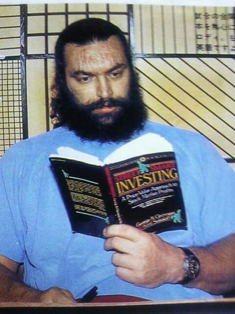 Bruiser Brody reading about investing... Bruiser Brody, Vince Mcmahon, Pro Wrestler, Pro Wrestling, Wwe, Wrestling, Baseball Cards, Mens Graphic Tshirt, Reading